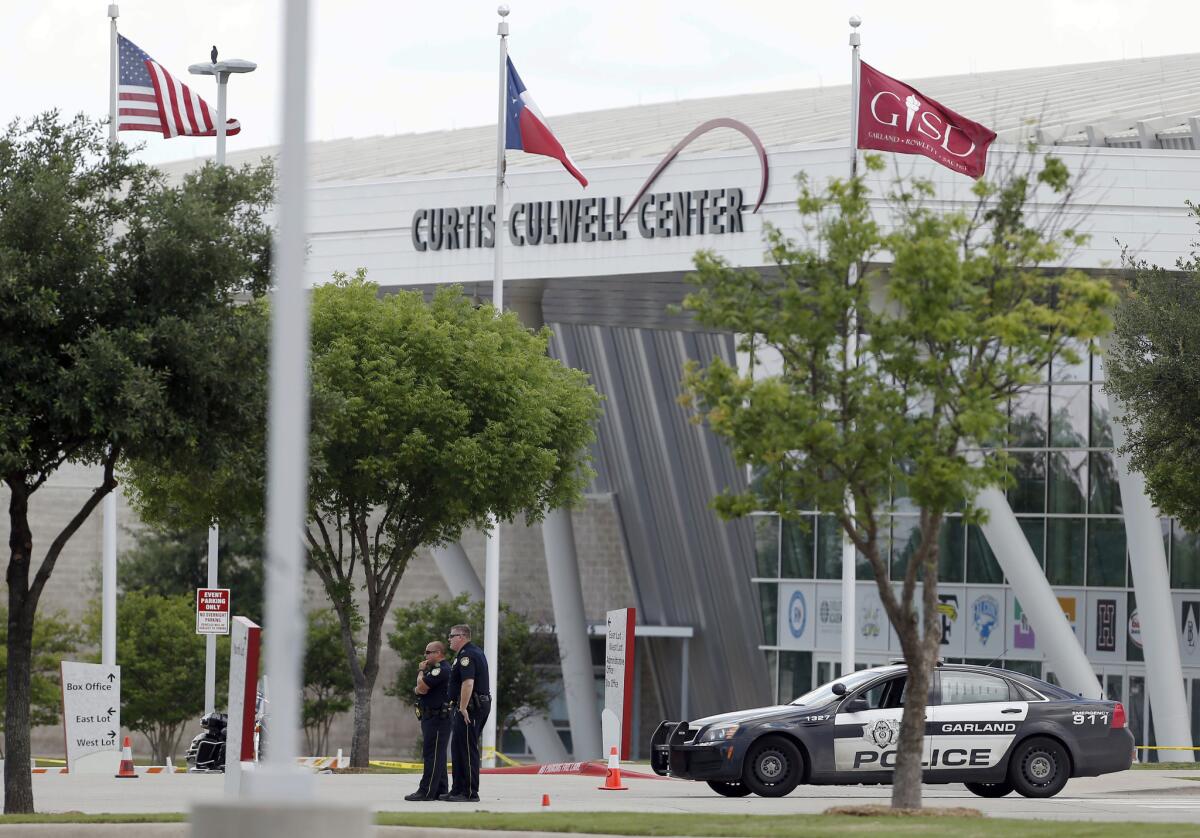 Police stand outside the Curtis Culwell Center in Garland, Texas, on Monday. A day earlier, two men fired on police who were guarding a provocative contest for Muhammad cartoons at the center; the men were subsequently shot to death by officers.