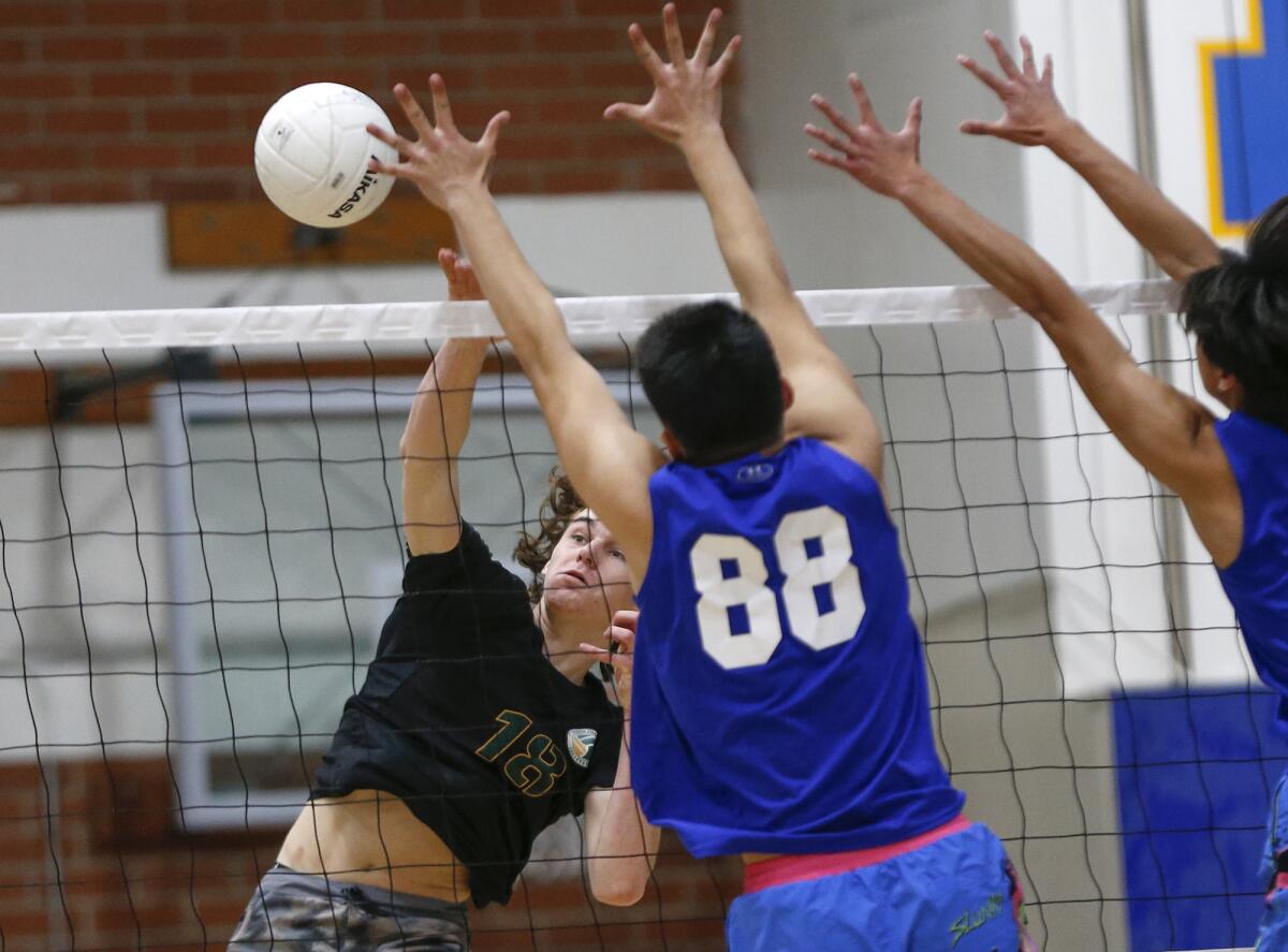 Edison's Owen Banner (18) puts a ball past Fountain Valley blocker Nicholas Kang (88) on Friday.