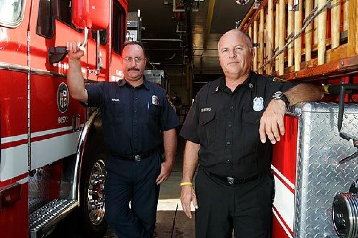 Los Angeles Firefighter Kevin Nagel, left, and Capt. Alan Barrios were the first on the scene of the Metrolink train crash Friday. After seeing the wreckage, Barrios, with 32 years of experience in the business, radioed for every heavy search-and-rescue unit in the city.