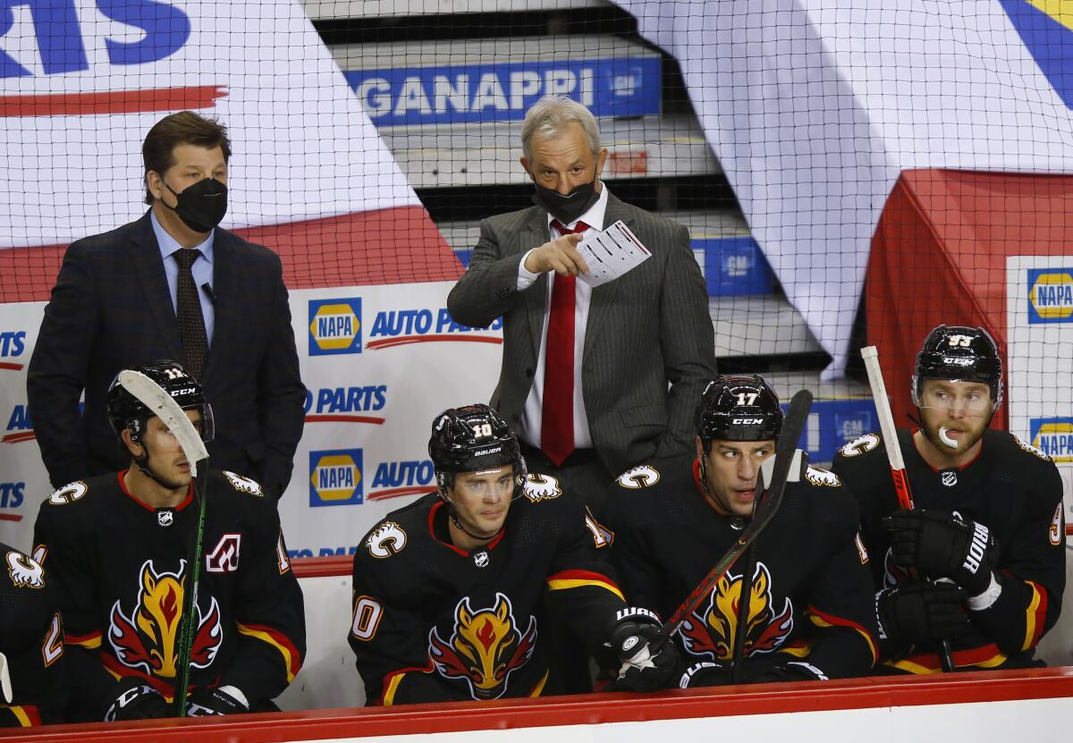 New Calgary Flames coach Darryl Sutter gives out instructions during the first period of the team's NHL hockey game against the Montreal Canadiens in Calgary, Alberta, Thursday, March 11, 2021. (Todd Korol/The Canadian Press via AP)