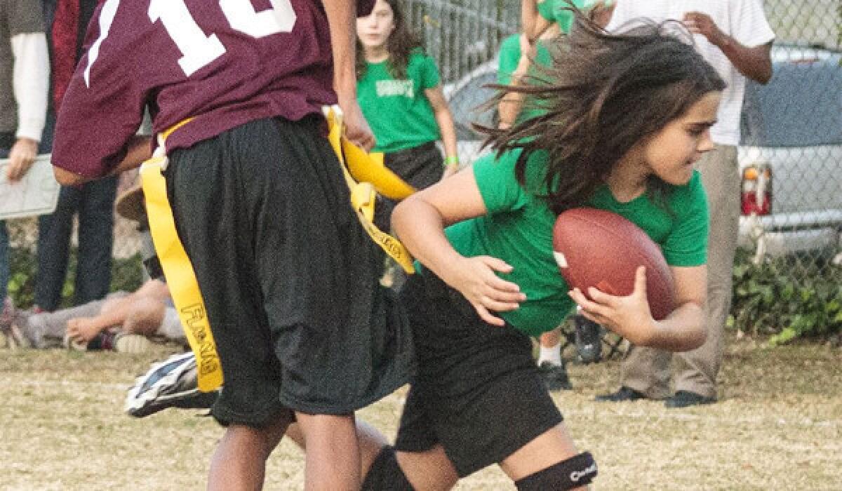 Ella Wood, the lone girl on the Sequoyah School flag football team, plays linebacker and tight end. Her school was forced to forfeit all its games for including a girl on the roster. On the field, they beat every team they faced.