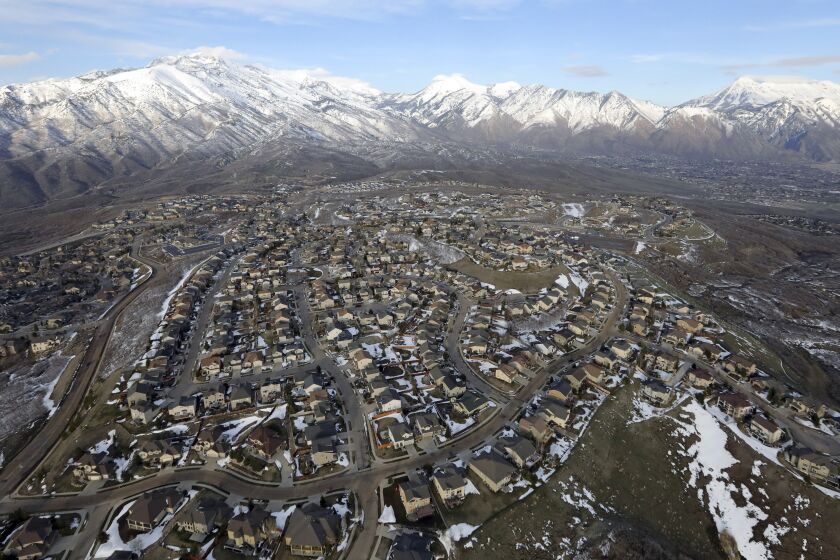 FILE - Rows of homes in suburban Salt Lake City are pictured on April 13, 2019. The U.S. Census Bureau said Wednesday, May 31, 2023, that it would once again delay the release, and narrow the scope, of some of the most detailed data from the 2020 census — this time until 2024. (AP Photo/Rick Bowmer, File)