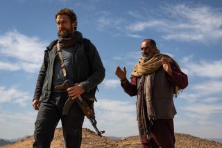 Gerard Butler and Navid Negahban in the movie "Kandahar."