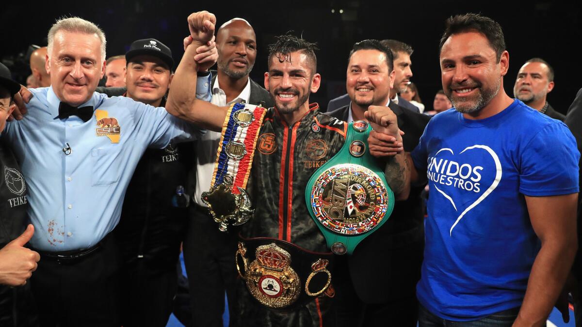 Jorge Linares celebrates after defeating Luke Campbell to retain his WBA lightweight title.