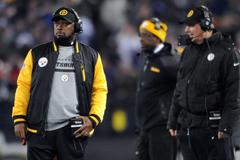 Pittsburgh Coach Mike Tomlin watches from the sideline during the Steelers' 22-20 loss to the Baltimore Ravens on Thanksgiving night.