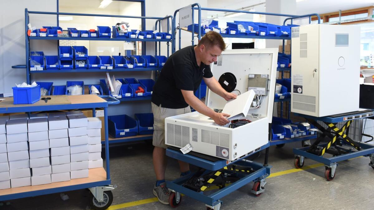 A man works for solar battery manufacturer Sonnen in Wildpoldsried, Germany, in 2016.