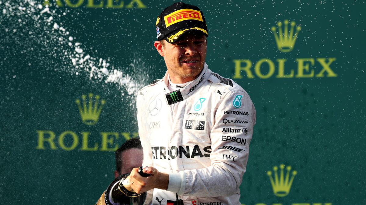 Formula One driver Nico Rosberg celebrates on the podium after winning the Australian Grand Prix on Sunday in Melbourne.