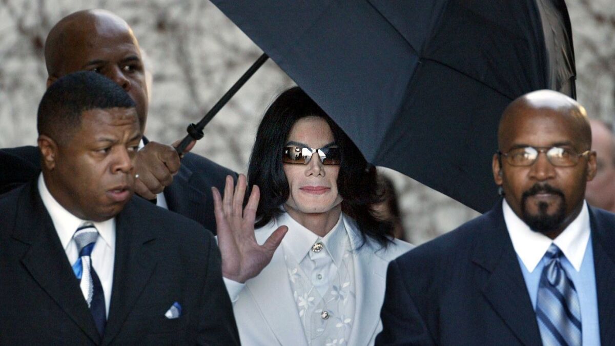 Pop singer Michael Jackson leaves court Jan. 31, 2005, in Santa Maria, Calif, at the end of court day during first day of jury selection in Jackson's child molestation trial.