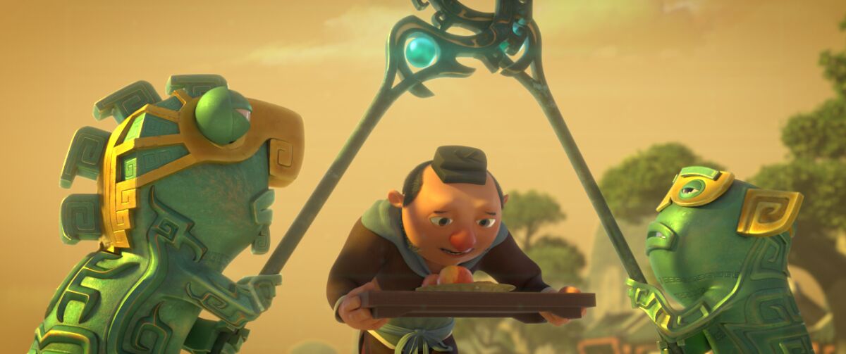 A man with his head bowed carries a tray of food between two green creatures in the animated movie "Ne Zha."