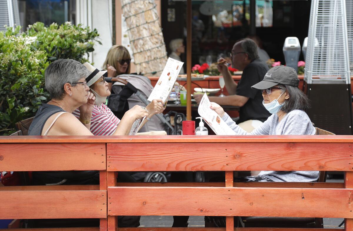 Guests dine at Alessa's in Laguna Beach on Wednesday.