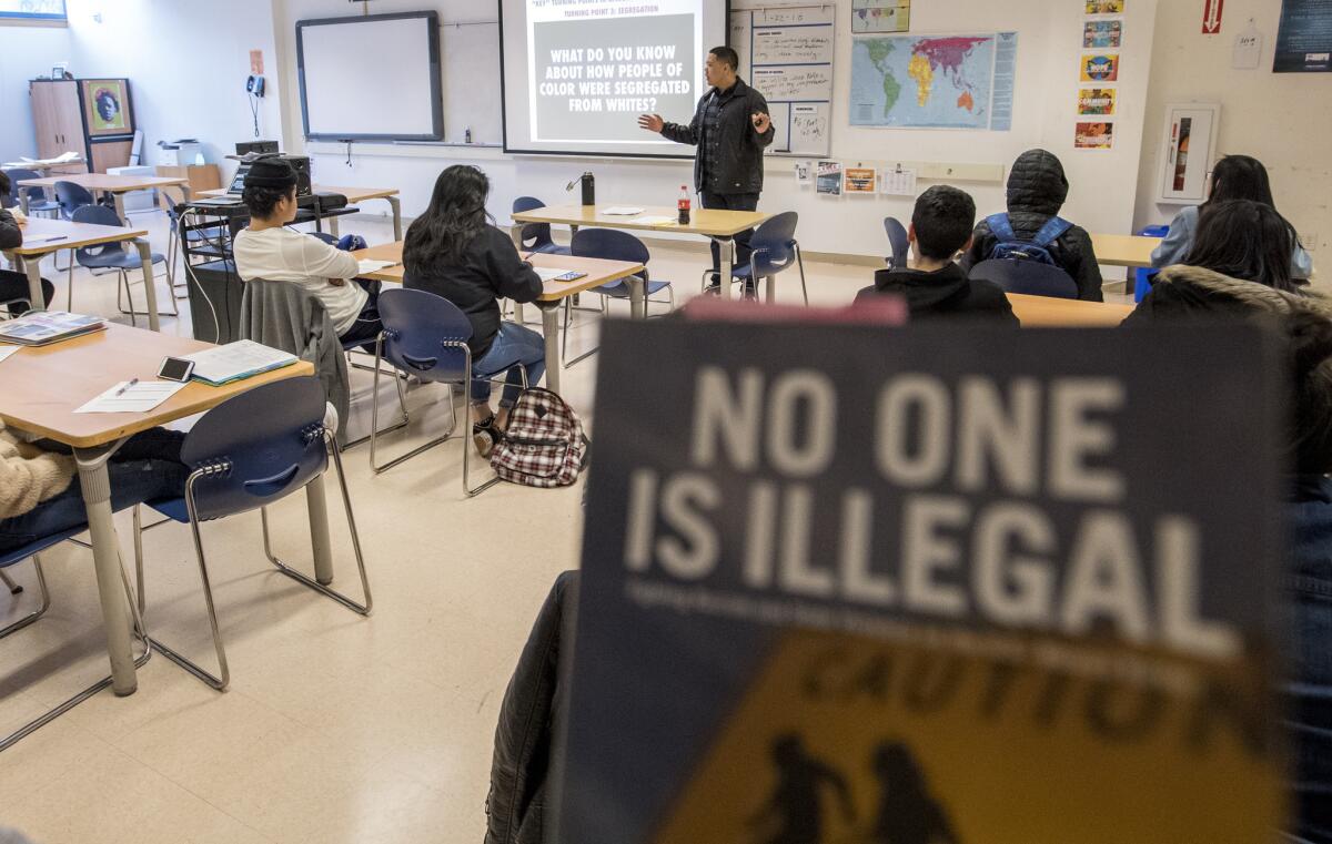 Teacher Jr Arimboanga shows his ethnic studies students a video about racism at John O'Connell High School in San Francisco.