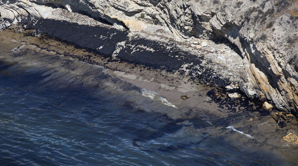 Oil stains on the shore near Refugio State Beach near Santa Barbara. A fisherman has filed suit against the operator of the pipe that burst in May.
