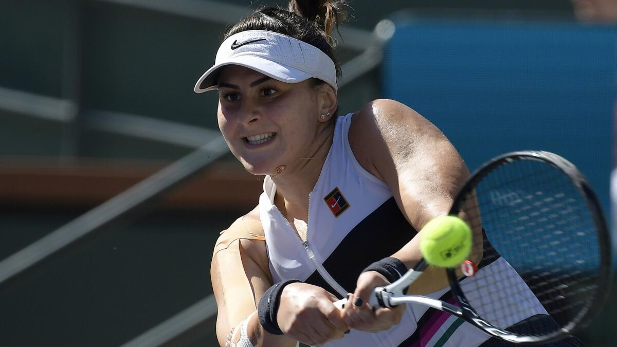 Bianca Andreescu returns a shot in her match against Angelique Kerber during the women's final of the BNP Paribas Open on Sunday in Indian Wells.