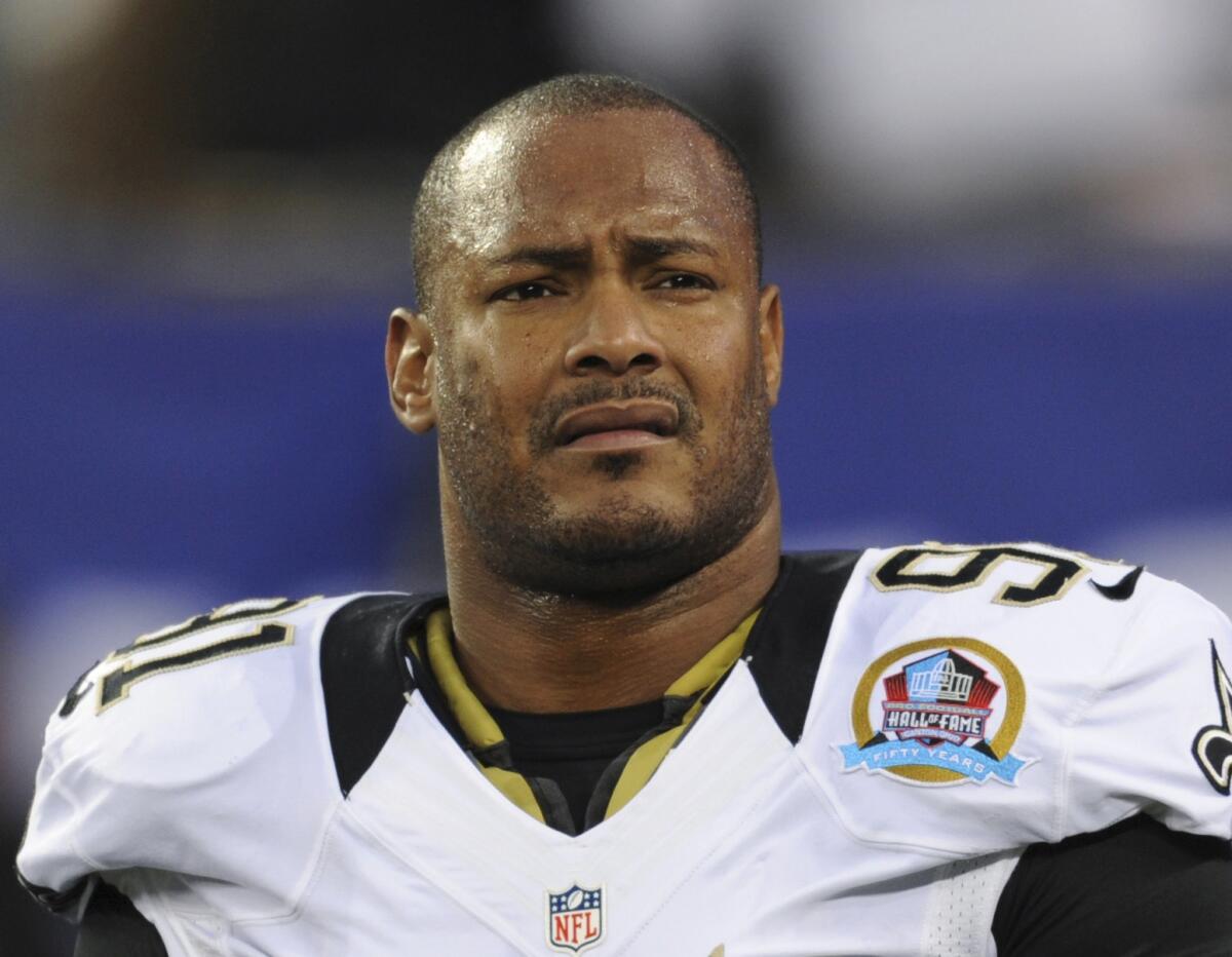 New Orleans Saints defensive end Will Smith appears before an NFL football game against the New York Giants on Dec. 9, 2012.