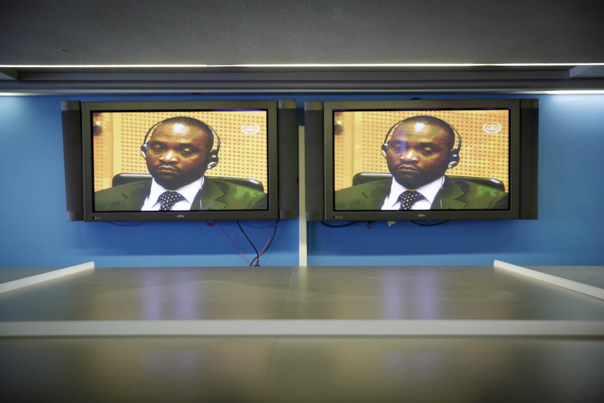 Images of Germain Katanga are broadcast on TV in the press room of the International Criminal Court in The Hague on Friday.