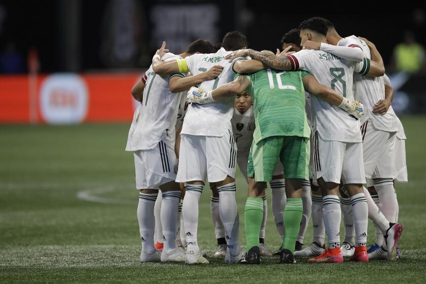Mexico groups together prior to the first half of an international friendly soccer match against Honduras on Saturday, June 12, 2021, in Atlanta. (AP Photo/Ben Margot)