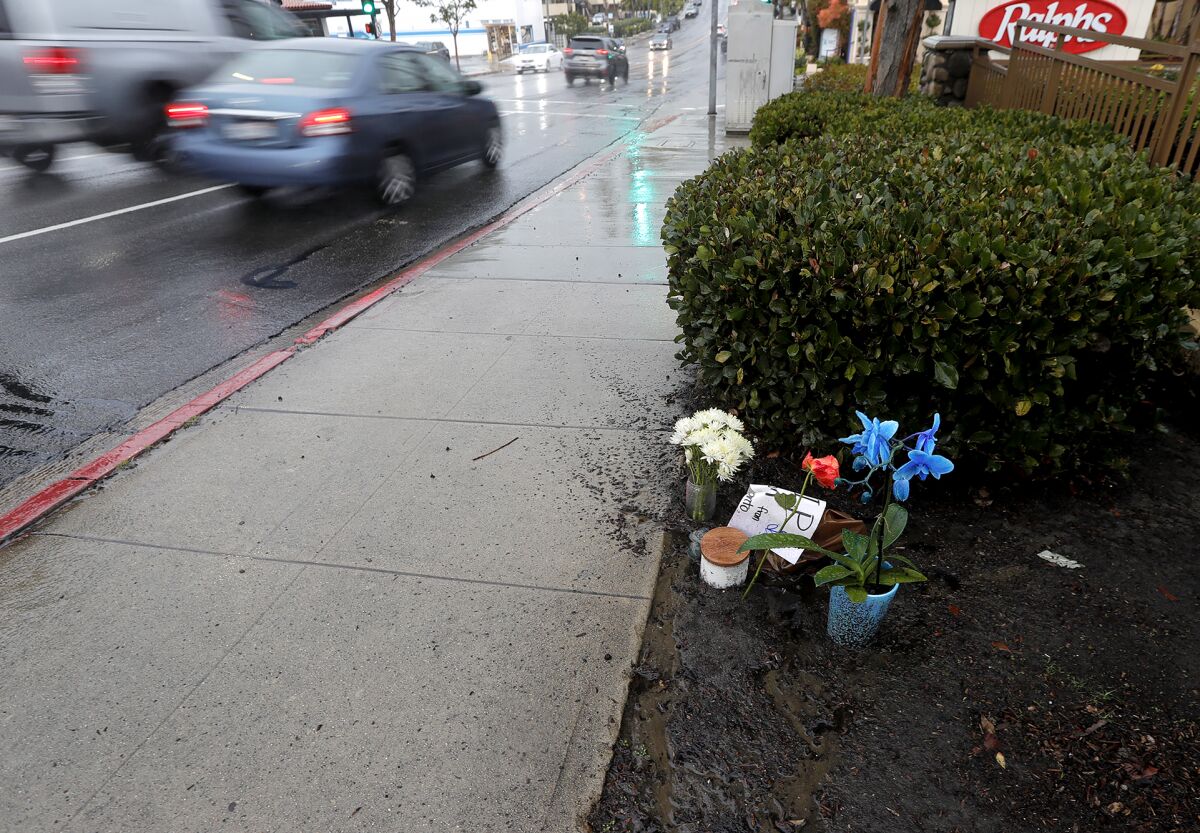 A small memorial is shown where Xueyuan Zhang, 39, died after being struck by a vehicle on Coast Highway on Saturday.