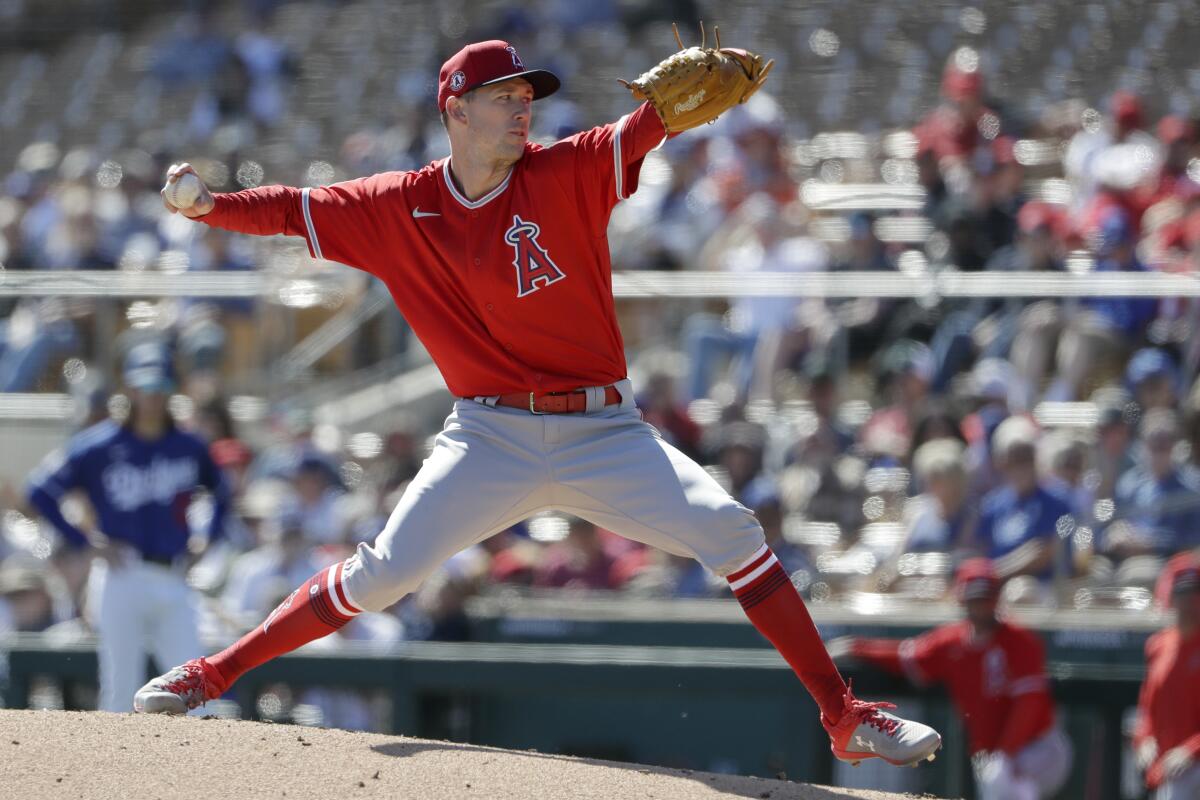 Angels starting pitcher Griffin Canning works against a Dodgers batter during the first inning of a spring training game on Wednesday in Phoenix.