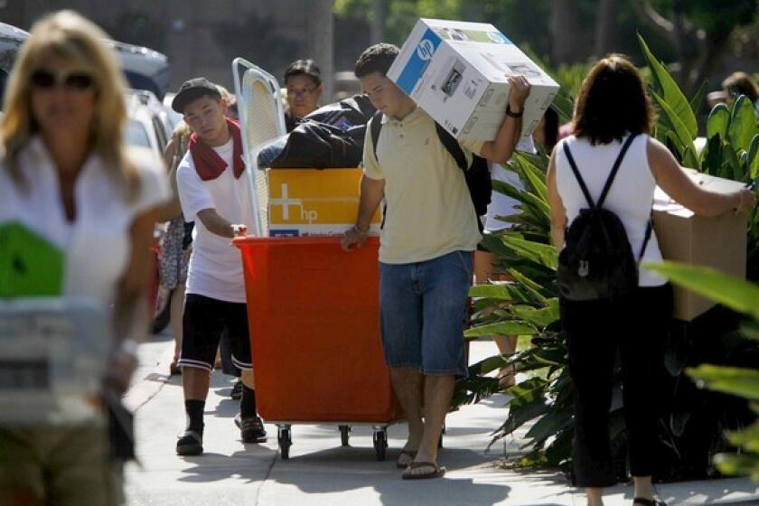 A college student's graduation doesn't have to mean a change in his or her healthcare coverage. New rules allow adult children to remain on their parents' policies until they're 26. Above, moving day at UCLA.