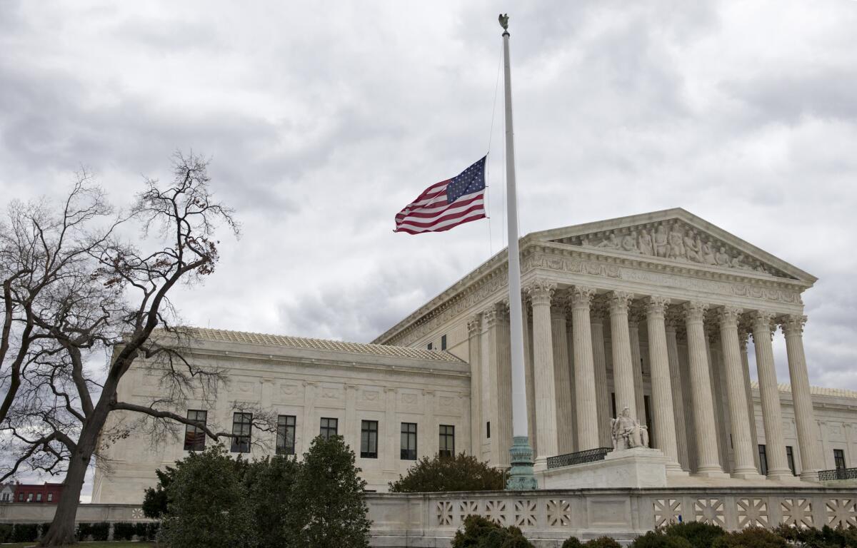 The flag in front of the U.S. Supreme Court flies at half-staff in February after the death of Justice Antonin Scalia, whose seat remains vacant.