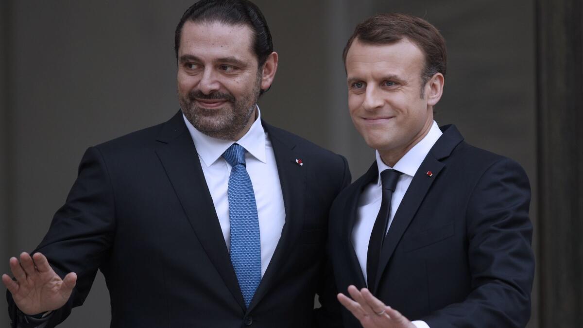 French President Emmanuel Macron, right, welcomes Lebanese Prime Minister Saad Hariri to the Elysee Palace in Paris on Nov. 18 2017.