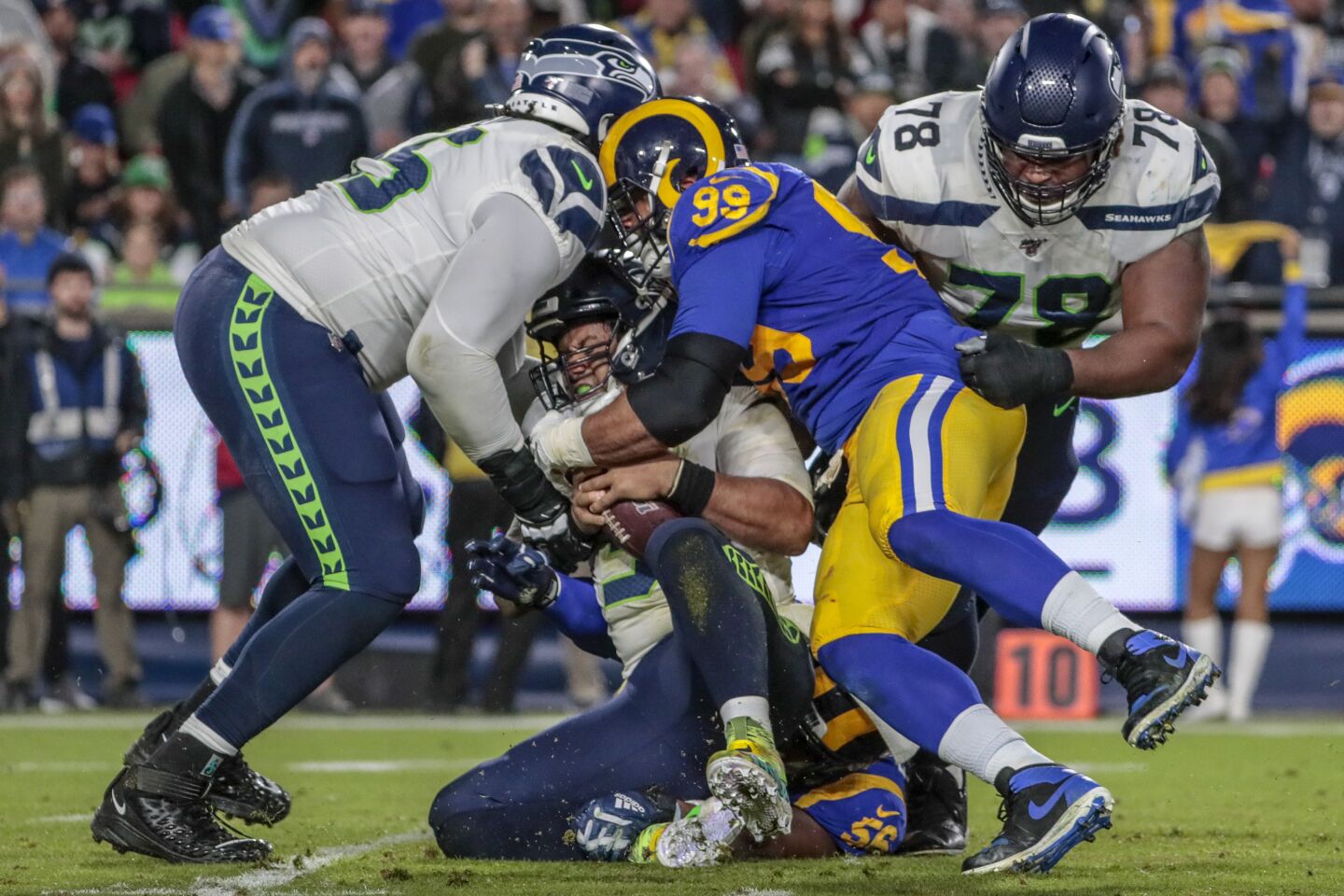 Rams defensive tackle Aaron Donald and linebacker Dante Fowler sack Seattle Seahawks quarterback Russell Wilson.