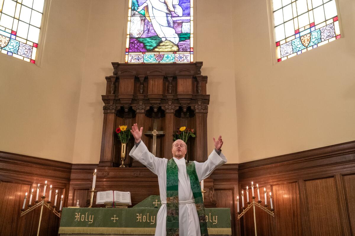 Pastor Todd Benson gestures during worship at Bethlehem Lutheran Church.