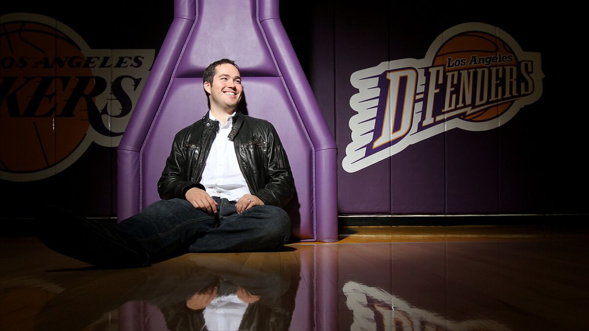 Joey Buss, who heads the Lakers' NBA Development League team the D-Fenders, smiles with sitting on the team's court in El Segundo in 2011.