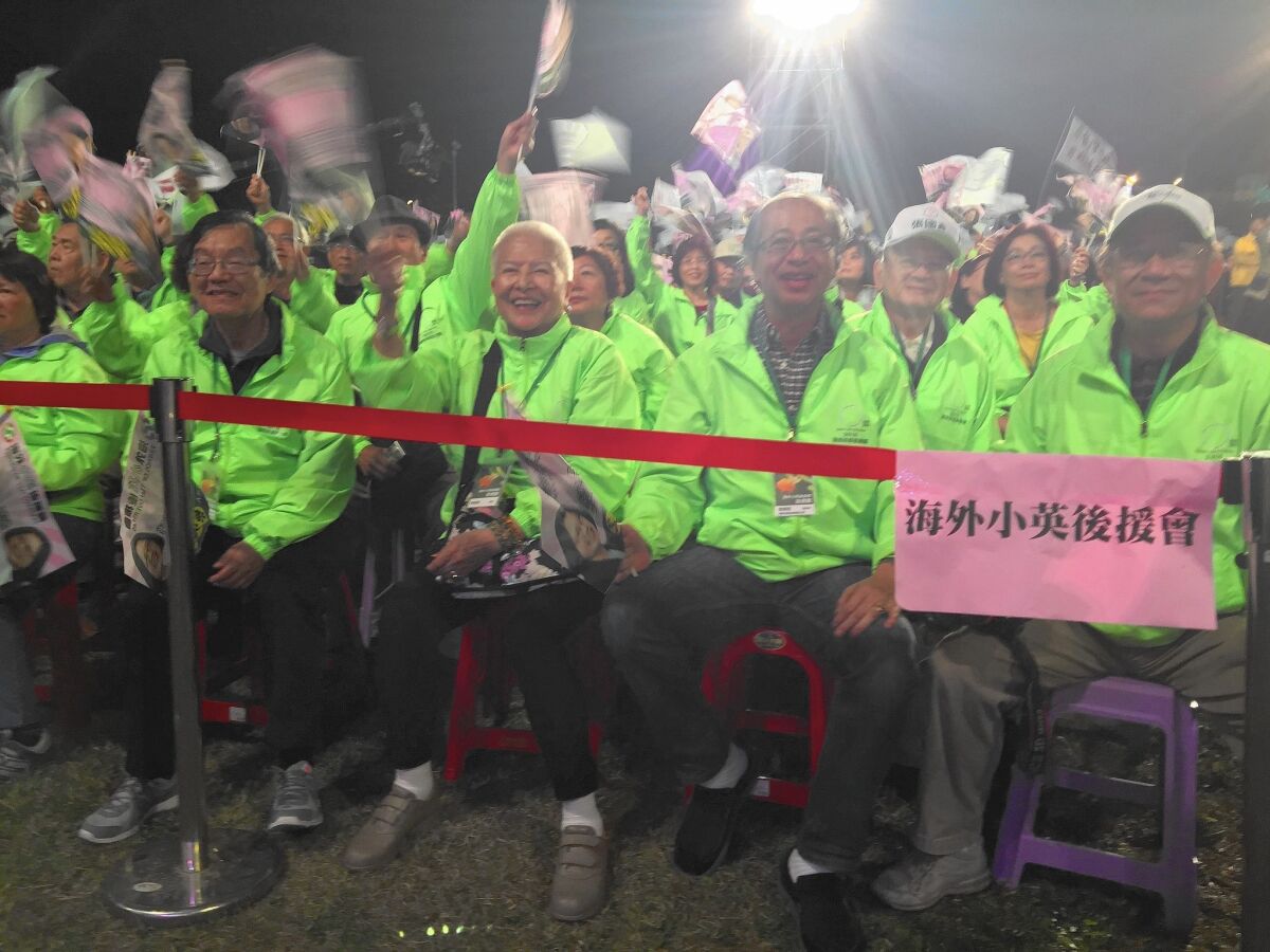 Members of the Friends of Tsai Overseas await the arrival of presidential candidate Tsai Ing-wen at a rally in Yuanlin, Taiwan.