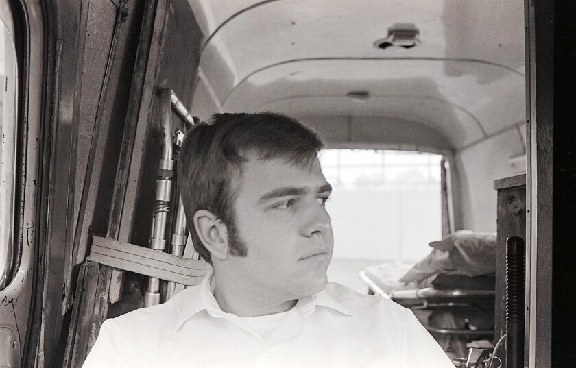 Mike Scardino sits in an ambulance circa 1967-1970.