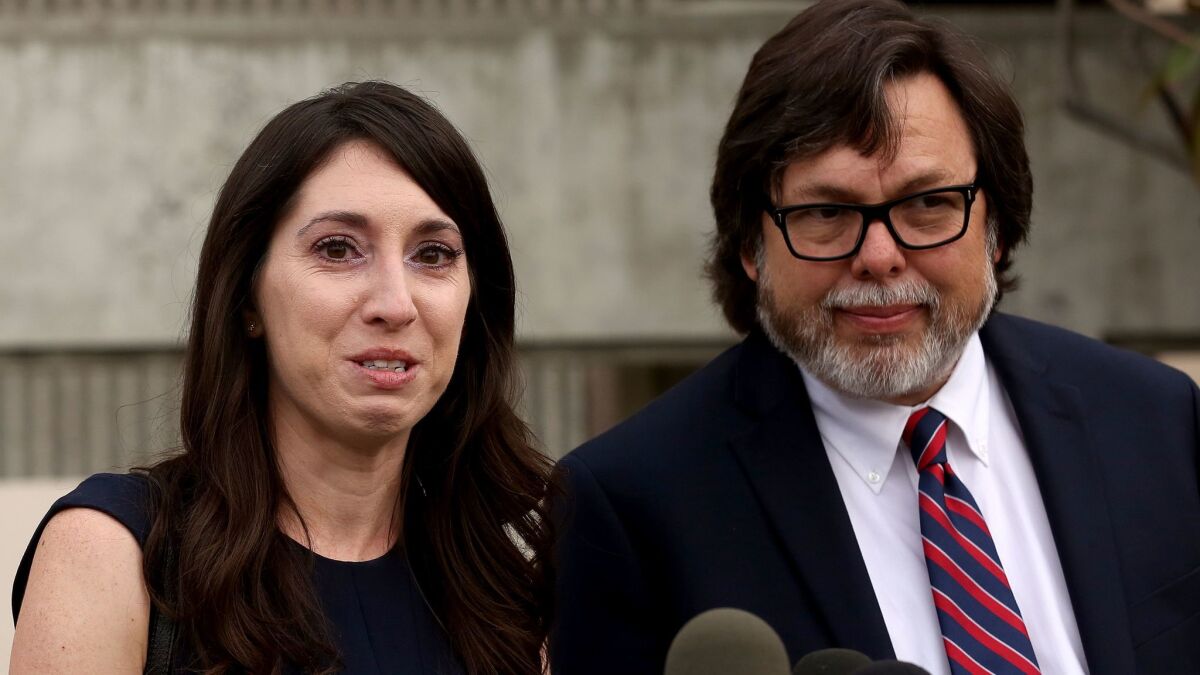 Michelle Hadley tears up while addressing reporters with her attorney Michael Guisti on Monday.