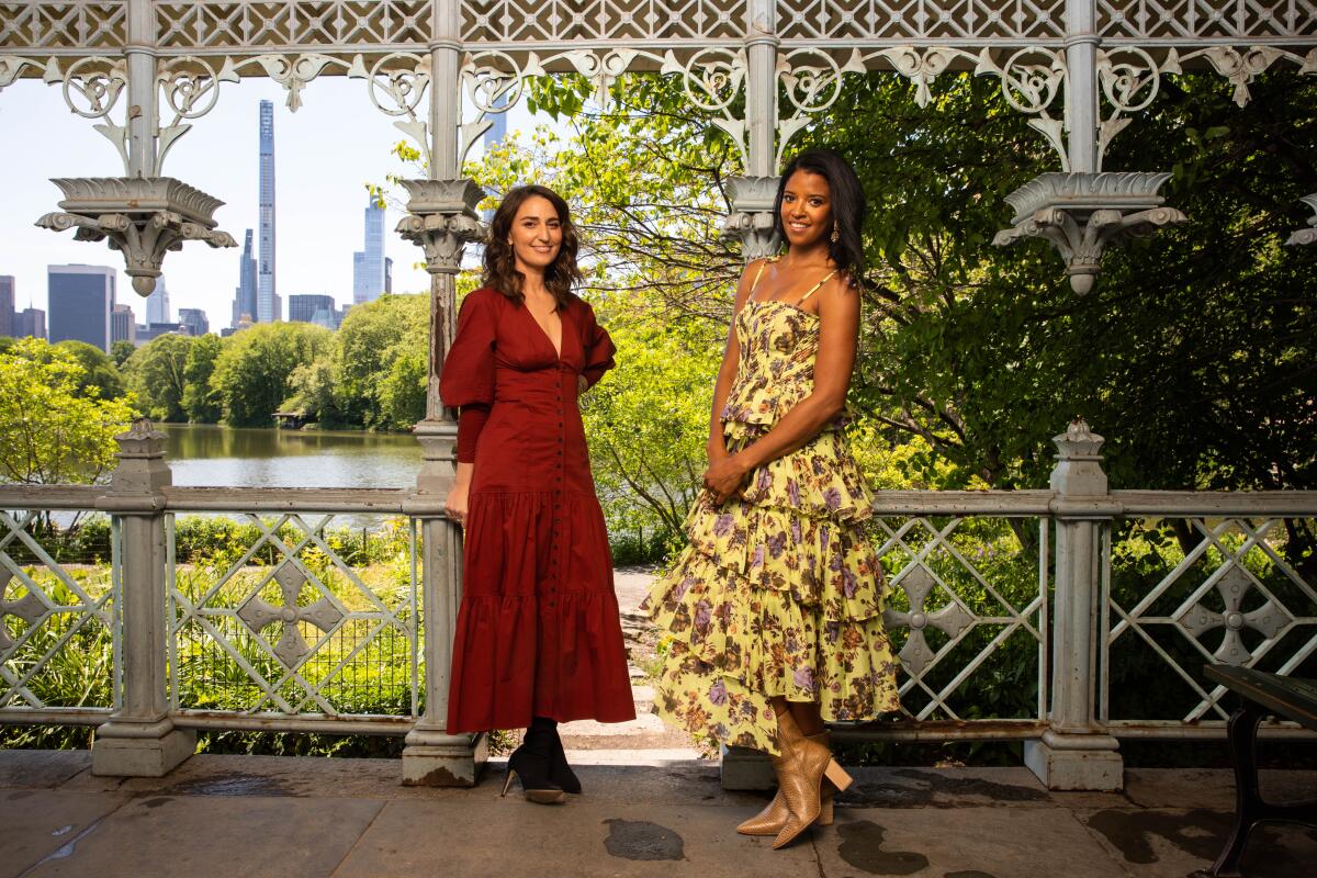 Sara Bareilles, left, and Renee Elise Goldsberry, right, who star in the Peacock show Girls5Eva