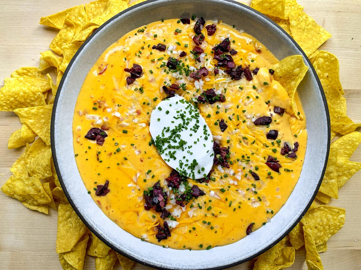 Pimento Queso: Orange dip with tortilla chips.