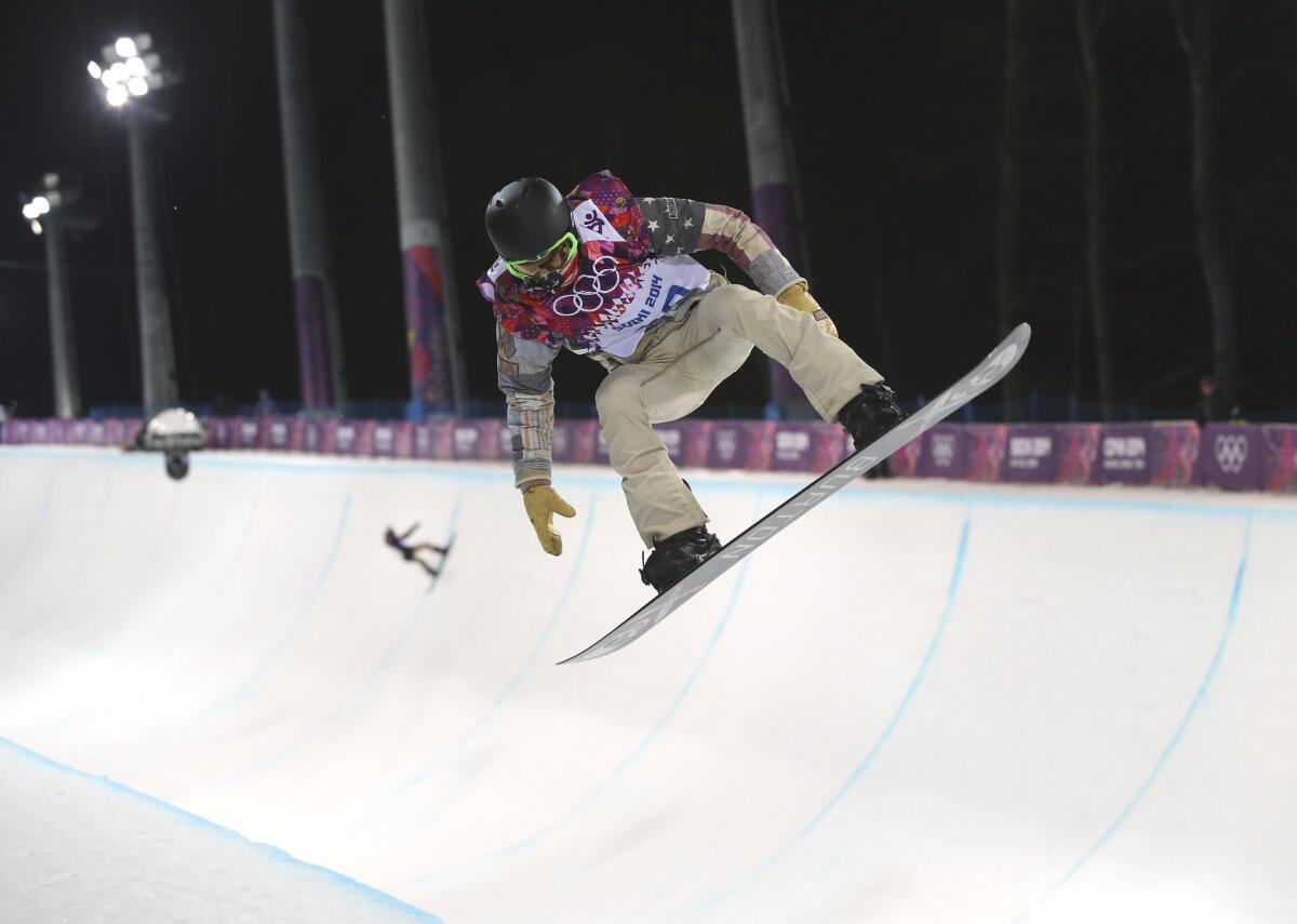 Shaun White gets air during a snowboard half pipe training session at the 2014 Winter Olympics on Feb. 10 in Krasnaya Polyana, Russia.