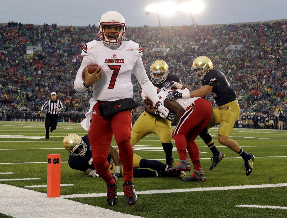 Louisville freshman quarterback Reggie Bonnafon runs for a touchdown against Notre Dame during the first half of the Cardinals' 31-28 win over the Fighting Irish.