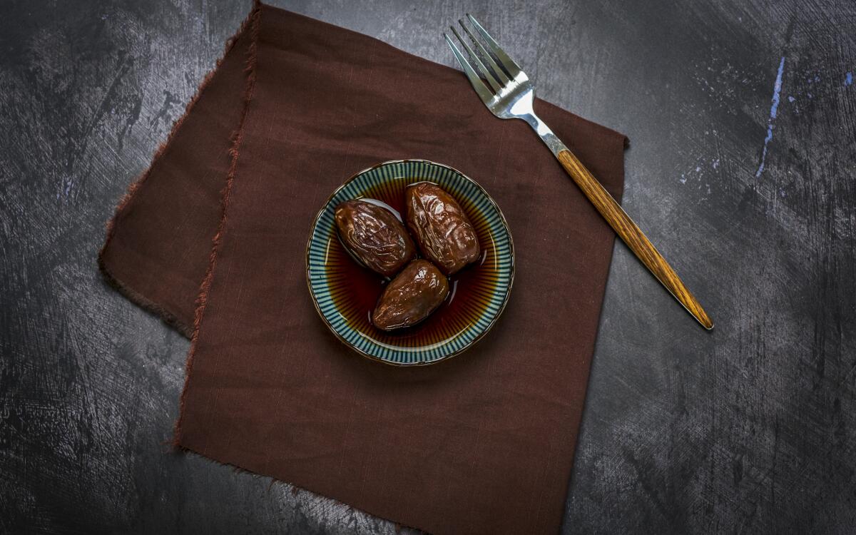 Leftover coffee adds pleasant bitterness and caffeine to large, sweet dates for a pick-me-up snack.