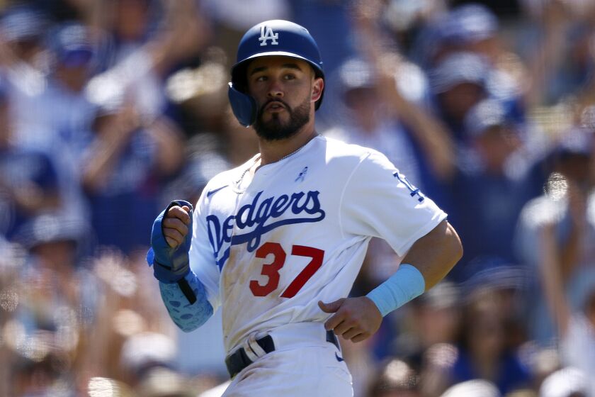 LOS ANGELES, CALIFORNIA - JUNE 19: Eddy Alvarez #37 of the Los Angeles Dodgers scores a run.