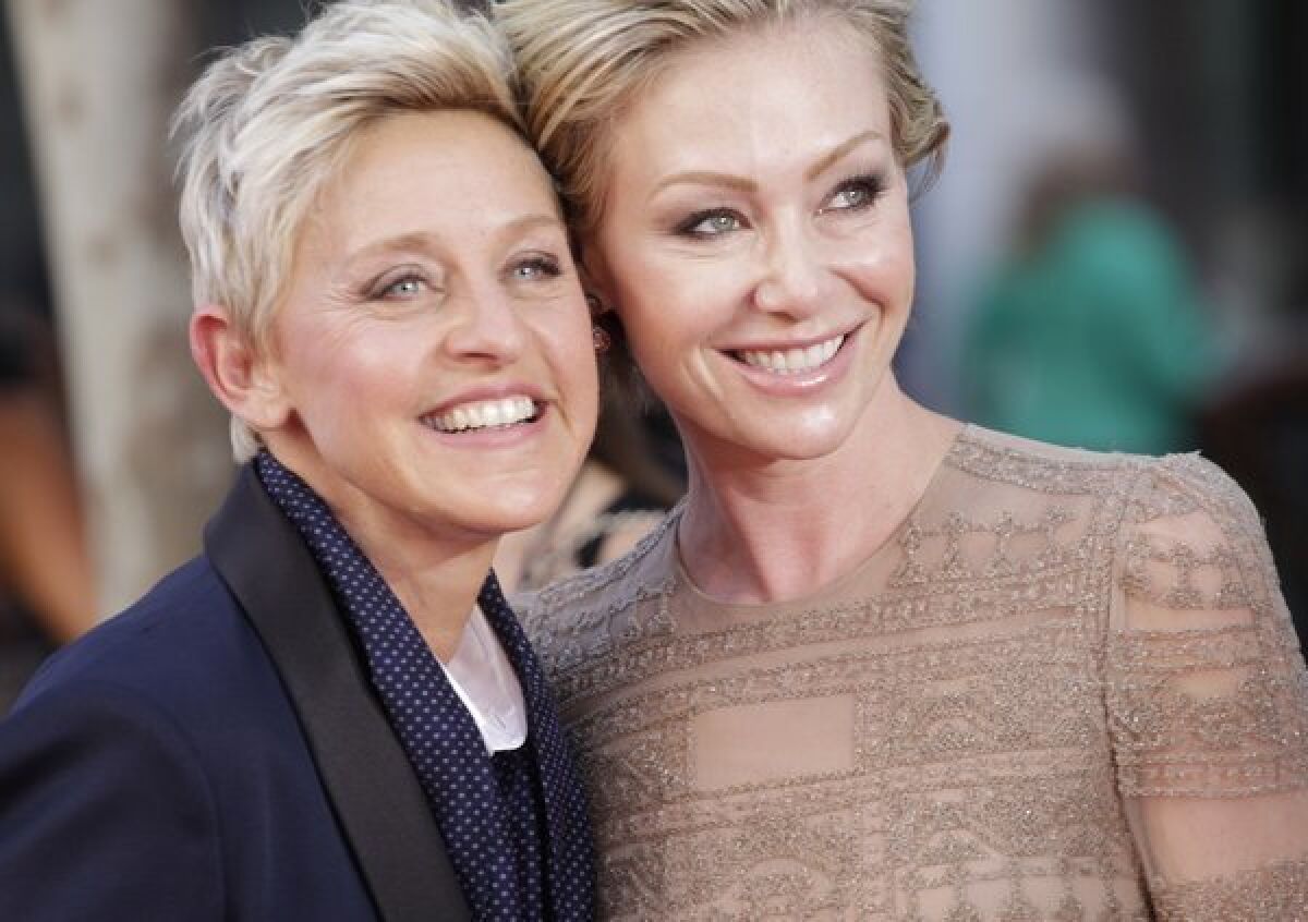 Ellen DeGeneres, left,  with wife Portia de Rossi. The couple have made another move in the L.A. real estate market, this time selling a glamorous Hollywood Regency-style home in Beverly Hills for $15.5 million.