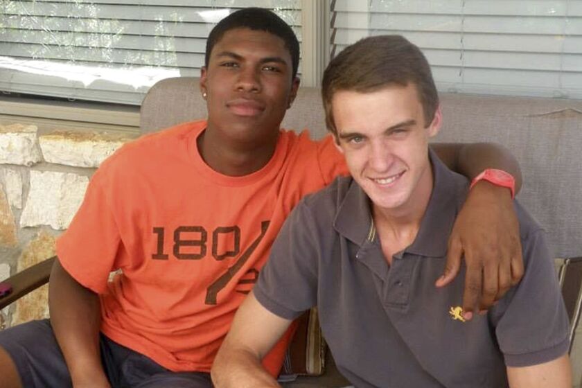 In this 2016 photo provided by John Gramlich shows, Bakari Henderson, left, with friend Travis Jenkins, in Austin, Texas. Henderson, of Austin and recent graduate from the University of Arizona, was beaten to death early Friday, July 7, 2017, at a bar in Lagana on the Greek island of Zakynthos. Authorities haven't disclosed a possible motive for the attack, but eight people have been arrested. (Provided Photo/John Gramlich via AP)