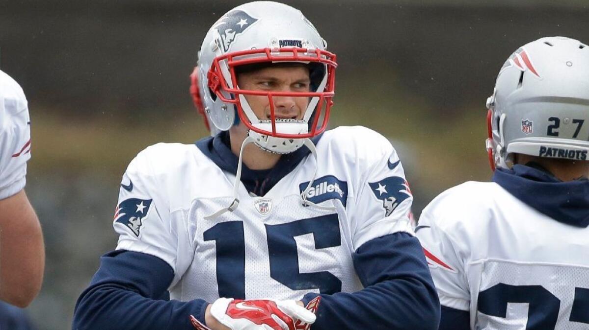 Patriots receiver Chris Hogan adjusts his gloves during a team practice on Jan. 26 in Foxborough, Mass.