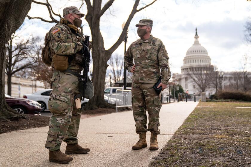WASHINGTON, DC - JANUARY 17: Maryland National Guard Adjutant General Timothy Gowen, speaks with members of the Maryland National Guard deployed to the U.S. Capitol on Sunday, Jan. 17, 2021 in Washington, DC. After last week's riots and security breach at the U.S. Capitol Building, the FBI has warned of additional threats in the nation's capital and across all 50 states. (Kent Nishimura / Los Angeles Times)