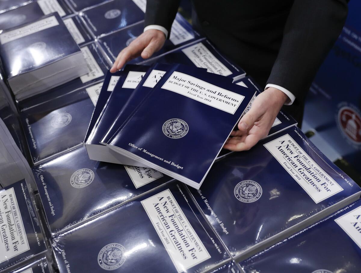 President Donald Trump's budget would likely result in a $720-billion deficit in 10 years, according to a Congressional Budget Office report.