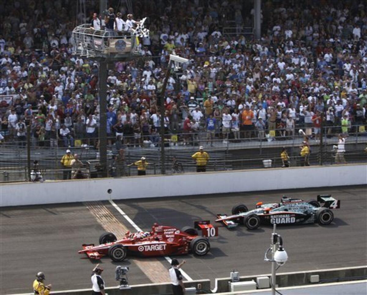 Dario Franchitti celebrates winning the Izod Indycar Series