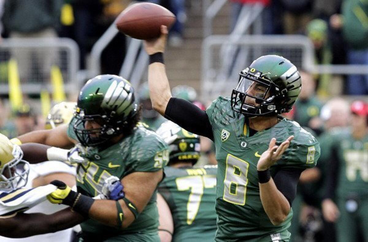 Ducks quarterback Marcus Mariota is a dual-threat quarterback with speed to burn and an accurate passing touch.