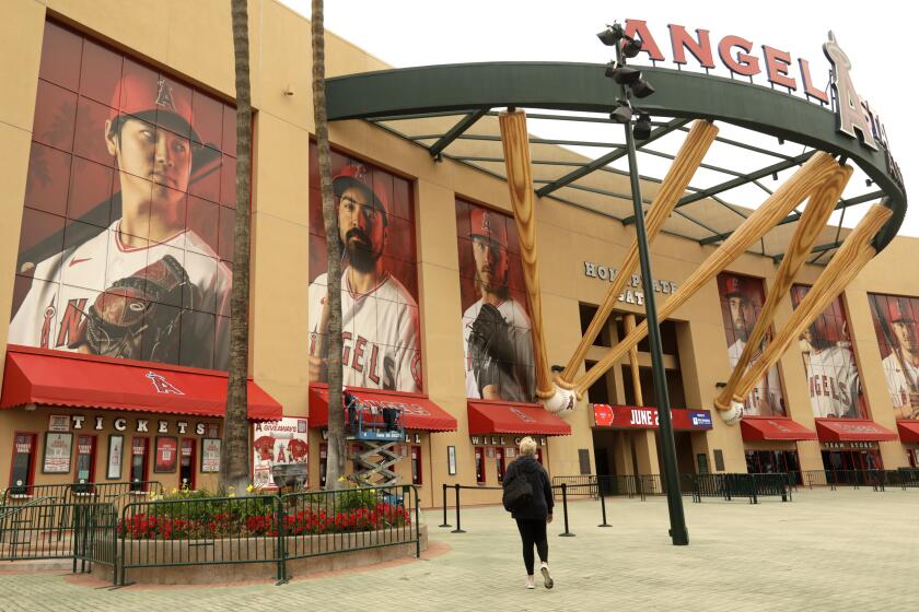 ANAHEIM, CA - MAY 23, 2022 - - A fan goes to buy tickets at the main entrance to Angel Stadium.