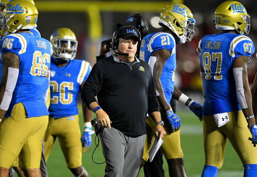 UCLA coach Chip Kelly walks the sideline during a game against Utah at the Rose Bowl in 2018.