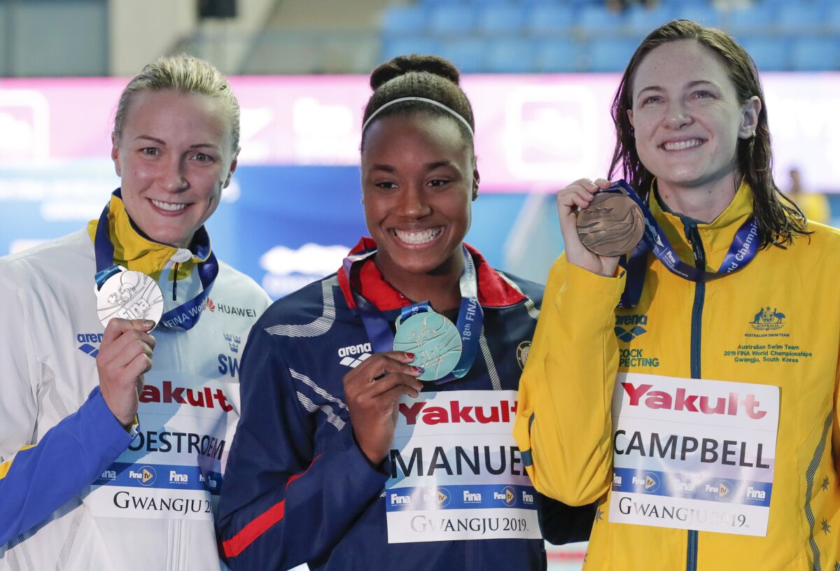 2018 world championships 50-meter gold medalist Simone Manuel with Sarah Sjostrom (silver), left, and Cate Campbell (bronze).