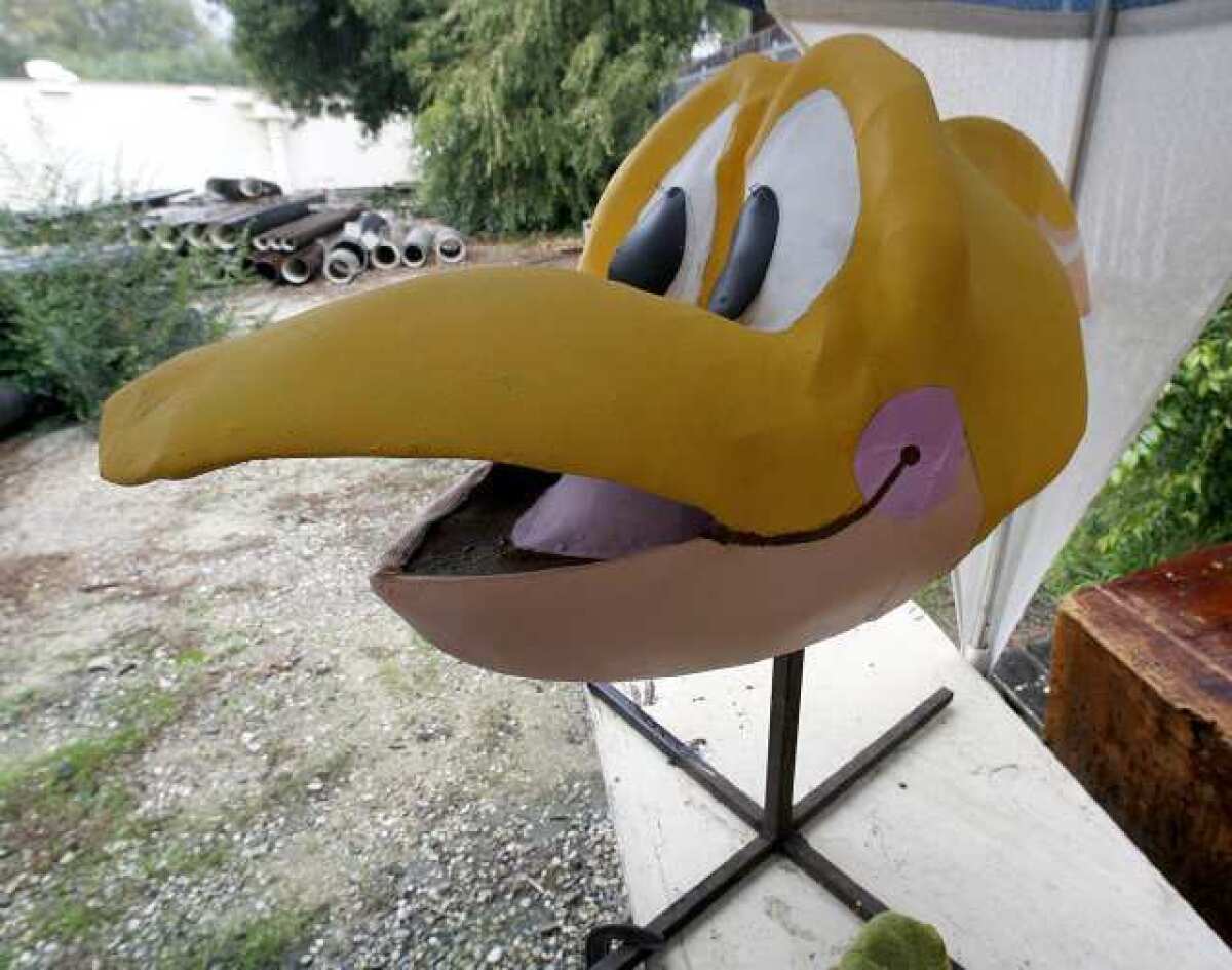A finished dinosaur head for the La Canada Flintridge Tournament of Roses Assn. 2013 Rose Parade float that is being built at the Valley Water Company back lot.