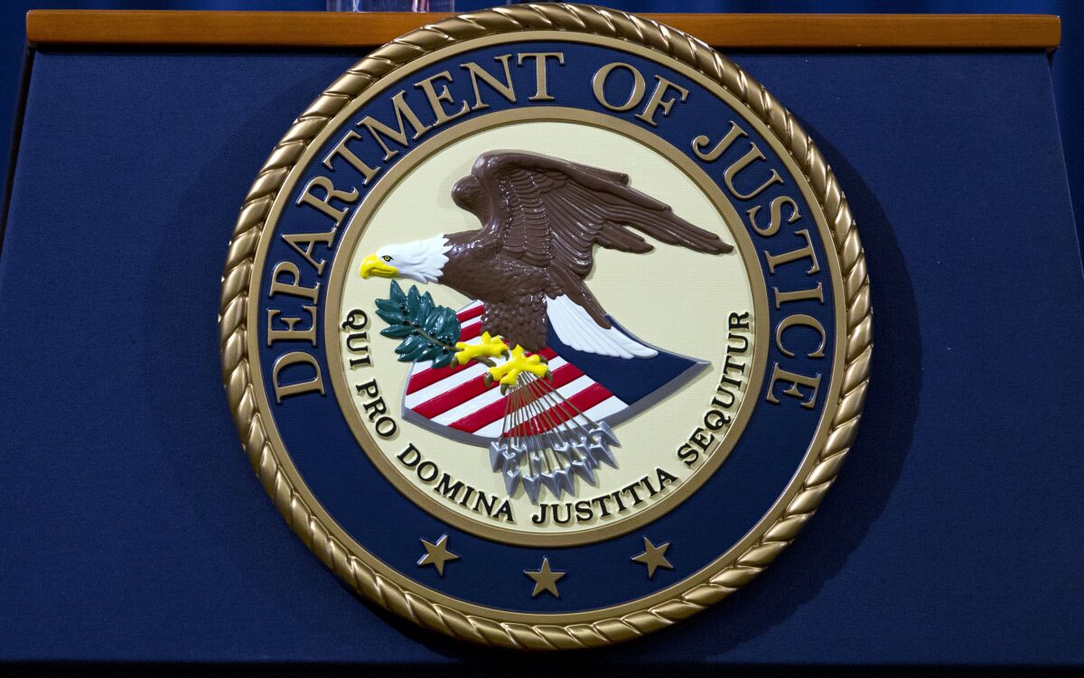 FILE - In this Nov. 28, 2018, file photo, the Department of Justice seal is seen in Washington, D.C. The Justice Department has released a new regulation spelling out detailed nationwide requirements for sex offender registration under a law Congress passed in 2006. The regulation released Monday stems from the Sex Offender Registration and Notification Act. It requires convicted sex offenders to register in the states in which they live, work or attend school. (AP Photo/Jose Luis Magana, File)