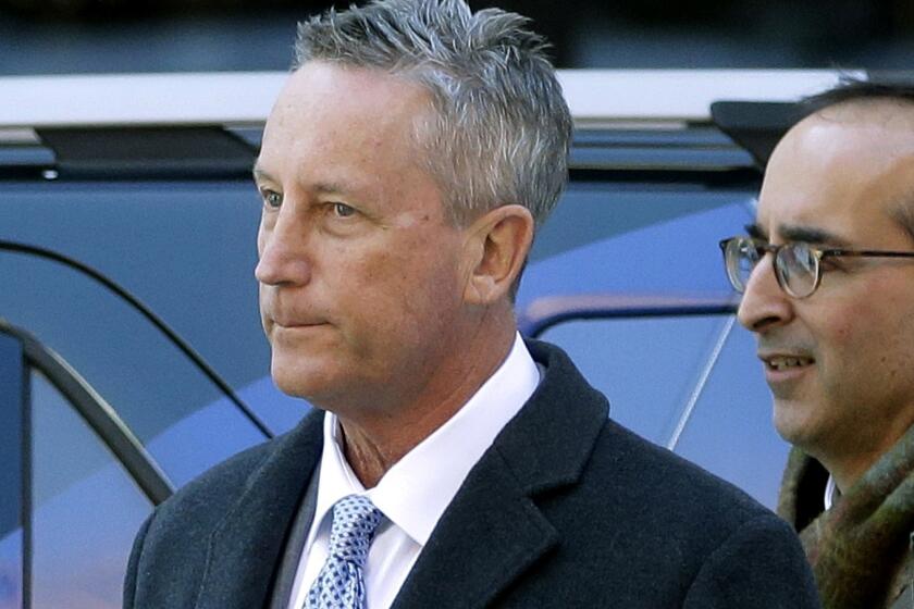 Martin Fox, from a private tennis academy in Houston, arrives at federal court in Boston to face charges in a nationwide college admissions bribery scandal on March 25.